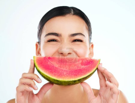 Photo for Watermelon smiles. Studio portrait of an attractive young woman posing with a watermelon against a light background - Royalty Free Image