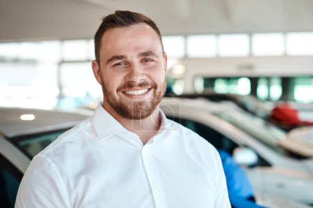 Photo for Time to move some cars off this lot. a car salesman in his dealership - Royalty Free Image