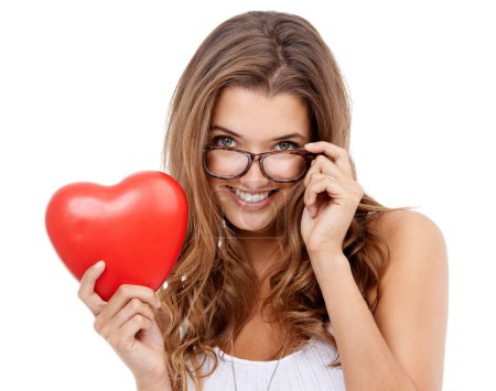 Photo for Shes ready for valentines day. Portrait of an attractive young woman holding a heart-shaped prop - Royalty Free Image