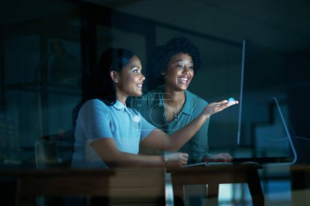 Photo for Who said the night was for sleeping. two young businesswomen using a computer together during a late night at work - Royalty Free Image