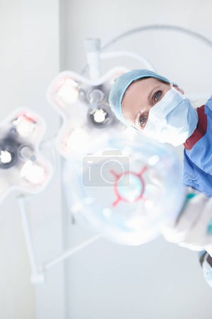 Photo for Take in a few deep breathes for me please. Patients view of a medical surgeonnurse putting them under a general anaesthetic - Royalty Free Image