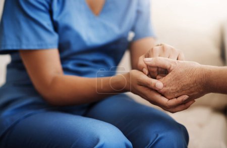 Photo for Im here to help lessen your burdens. an unrecognizable nurse holding a senior womans hands in comfort - Royalty Free Image