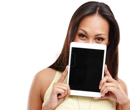 Photo for Emoticons are my feelings now. Portrait of an attractive young woman holding up a digital tablet so that it covers the lower half of her face isolated on white - Royalty Free Image