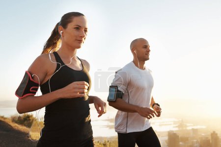 Photo for Wellness, fitness or people running and listening to music in morning workout or exercise for wellness. Sport, man and woman runner with athlete as training for marathon run, sports or energy radio. - Royalty Free Image