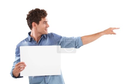 Photo for Pointing you in the right direction. A young man holding a placard and pointing away - Royalty Free Image