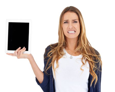 Foto de La ansiedad de separación de la nueva era. Una joven mujer que parece disgustada mientras sostiene una tableta - Imagen libre de derechos