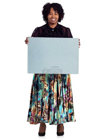 Photo for Trust me, this is important...Studio portrait of an african woman holding up a blank board against a white background - Royalty Free Image