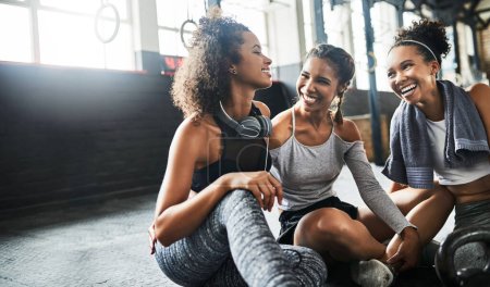 Photo for The best friendships are forged through fitness. a group of happy young women taking a break together at the gym - Royalty Free Image