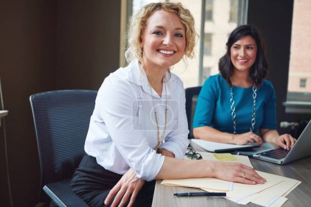 Photo for We conduct business with a can do attitude. Portrait of two businesswomen having a meeting together in an office - Royalty Free Image