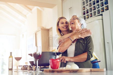 Photo for Hug, mother or happy woman cooking food for a healthy vegan diet together with love in family home. Smile, embrace or adult child hugging or helping senior mom in house kitchen for lunch or dinner. - Royalty Free Image