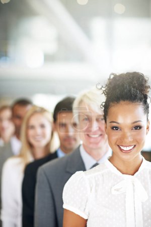 Photo for Portrait, leadership and a business black woman manager at the from of a queue in her corporate office. Smile, management and a happy female leader standing in line with a team following her vision. - Royalty Free Image