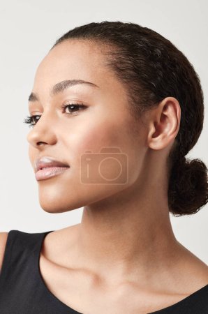 Photo for Black woman, profile and natural beauty with confidence and cosmetics in a studio. Isolated, white background and young face of a African female person and model relax with makeup and confidence. - Royalty Free Image