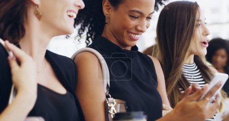 Photo for Arriving to work in good spirits. three young beautiful businesswomen walking through a modern office - Royalty Free Image