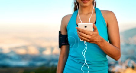 Photo for Theres a playlist for that. an unrecognizable young woman listening to music while out for a run - Royalty Free Image
