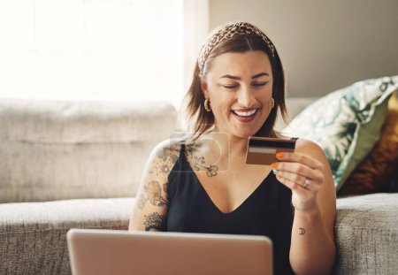 Photo for Credit card, happy woman and home, computer and online shopping, ecommerce or fintech application, loan or finance. Person on laptop, website payment or internet banking with security pin or numbers. - Royalty Free Image