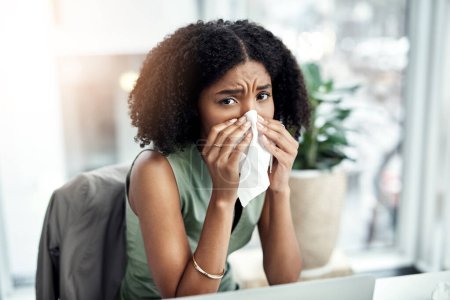 Photo for Allergies, blowing nose or sick black woman in office or worker with hay fever sneeze or bad illness. Sneezing, flu or sad businessperson with toilet paper tissue, allergy virus or disease at desk. - Royalty Free Image