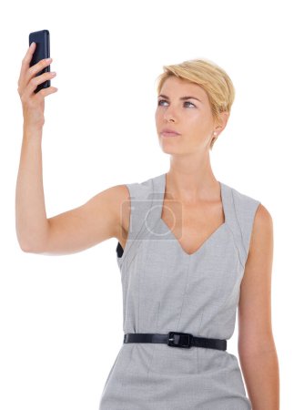 Photo for No reception. a young businesswoman searching for signal on her cellphone - Royalty Free Image