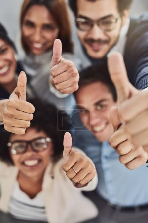Photo for Business people, hands and thumbs up above for winning, success or teamwork at the office. Top view of employee group showing hand or thumb emoji, yes sign or like in team win, victory or good job. - Royalty Free Image