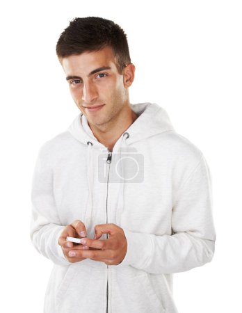 Photo for Living in the world of technology. Portrait of a casual male texting on his cellphone - Royalty Free Image