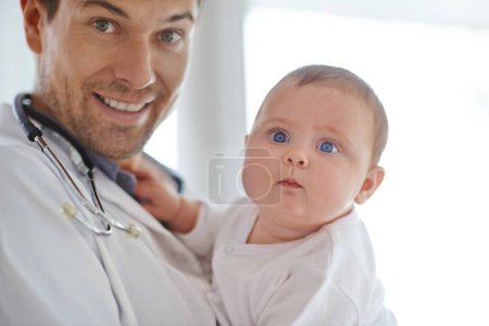 Photo for Portrait, pediatrician and holding baby in clinic assessment, medical support and growth. Newborn kids, happy man and pediatrics doctor in hospital for healthcare, consulting and wellness of children. - Royalty Free Image