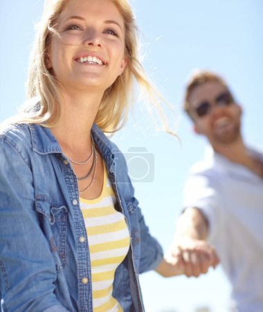 Téléchargez les photos : Love, holding hands and couple walking, happy and enjoy outdoor quality time together, bond and fun romantic date. Freedom, peace and happiness for man and woman on summer holiday in Lisbon Portugal. - en image libre de droit
