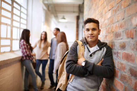 Photo for Education, arms crossed and portrait of man in college hallway for studying, learning or scholarship. Future, school and knowledge with student leaning on brick wall for university, academy or campus. - Royalty Free Image