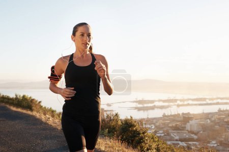 Photo for Running, street and woman training, workout and fitness with freedom, view and balance outdoor. Female person, lady and athlete with a healthy lifestyle, runner and exercise with wellness and cardio. - Royalty Free Image