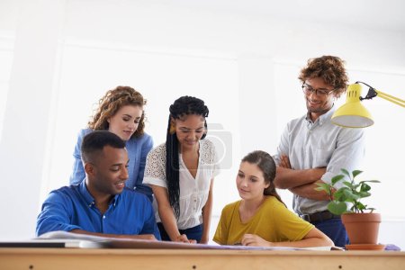 Photo for Diversity, business people and documents in team strategy for planning, brainstorming or design at the office. Group of diverse employees working on paperwork in teamwork collaboration at workplace. - Royalty Free Image