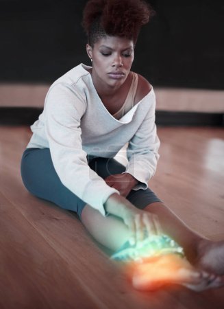 Photo for Woman, ankle pain or injury on floor at fitness studio with burnout or health problem. Female dancer or athlete with ice pack on red anatomy glow for arthritis, accident and feet while tired. - Royalty Free Image