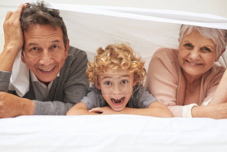 Photo for Portrait, grandparents or excited boy in bedroom to relax together for bonding in Australia with love or care. Morning, faces or happy grandmother with funny kid or old man to enjoy quality bed time. - Royalty Free Image