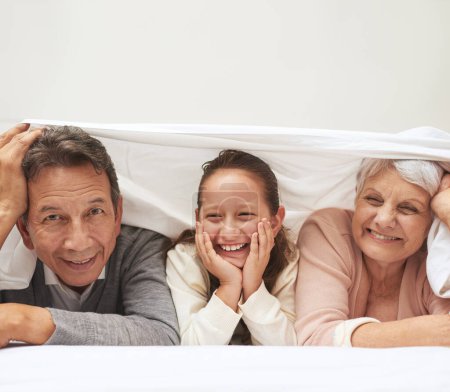 Photo for Portrait, grandparents or happy girl in bedroom to relax together for bonding in Australia with love or care. Morning, faces or grandmother with funny child or old man to enjoy quality time on bed. - Royalty Free Image
