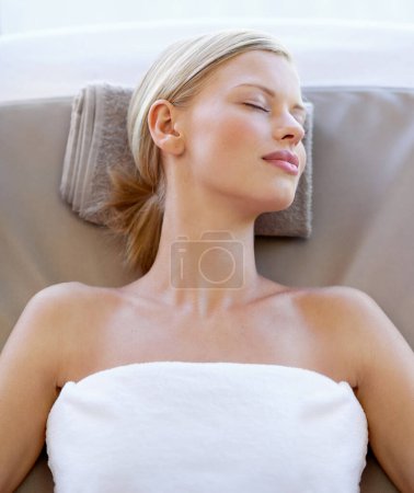 Photo for Spa salon, relax and face of a woman for beauty, wellness or skincare from above. Female client sleeping on massage table for peace with luxury facial cosmetic, zen treatment and healing or health. - Royalty Free Image