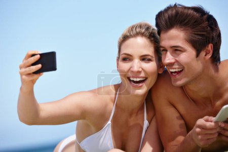 Photo for Summer snapshots. a happy young couple taking a selfie together at the beach - Royalty Free Image