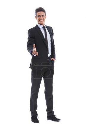 Foto de Encantado de conocerte. Retrato de un joven y apuesto hombre de negocios extendiendo su mano para un apretón de manos - Imagen libre de derechos