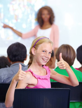 Photo for Thumbs up, classroom and girl portrait for learning success, support and thank you sign for education, school or geography. Like, yes and achievement hands or emoji of happy child with map teaching. - Royalty Free Image
