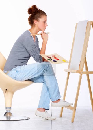Photo for Woman, painting and thinking about art canvas in studio for creativity and talent with paint brush for color. Female artist or painter isolated on a white background for creative work and ideas. - Royalty Free Image
