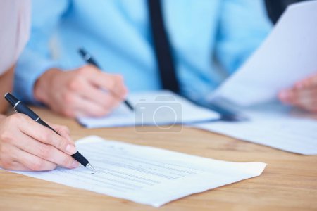 Photo for Business people, hands and writing on spreadsheet for finance paperwork or budget expenses on office desk. Hand of accountant team with financial report, documents or account with pen during audit. - Royalty Free Image
