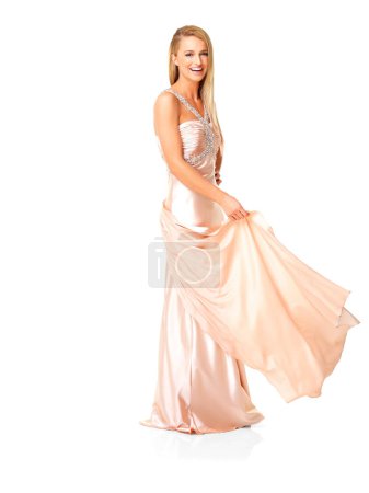 Téléchargez les photos : Beauty, fashion and elegant prom dress on young woman feeling happy, playful and beautiful in evening gown with copy space. Portrait of a laughing woman choosing the perfect prom or bridesmaid outfit. - en image libre de droit