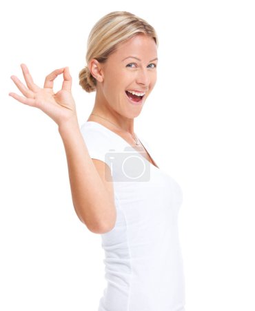 Photo for Excited woman, hand sign and ok portrait in studio for happiness, agreement and support. Face of a happy female model isolated on a white background to show hands, icon or emoji for review or opinion. - Royalty Free Image