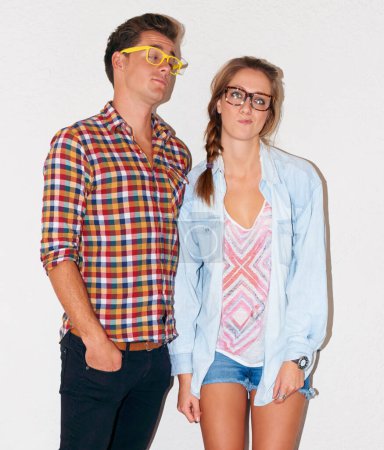 Photo for Crazy nerd couple at party, glasses and funny face with gen z fashion with university youth culture. Goofy woman, man and celebration at fun college, silly hipster people on white wall background - Royalty Free Image