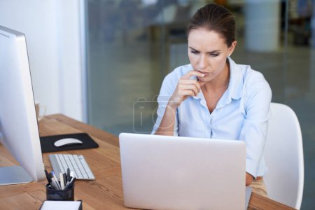 Photo for Confused, business woman and thinking at laptop for decision, choice of solution and problem solving. Serious female worker at computer for planning, doubt of ideas and questions for online analysis. - Royalty Free Image