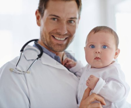 Photo for Portrait, happy pediatrician and holding baby in hospital for medical support and growth. Newborn kid face, man and pediatrics doctor in clinic, healthcare service or smile of trust for children. - Royalty Free Image