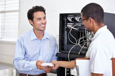 Photo for Server room, man or technician giving modem hardware for maintenance for connection in business office. Electronics, help or worker with an electrician or tech support for information technology. - Royalty Free Image
