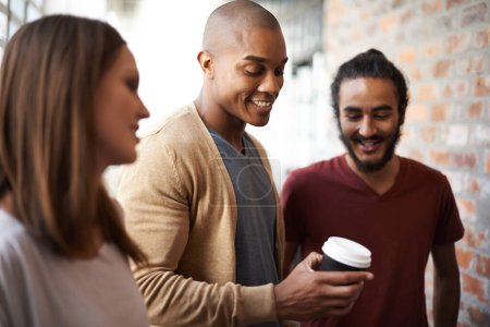 Photo for College, friends or students talking with coffee in a hallway for discussion, happiness and a drink. Diversity men and a woman at campus or university for a happy chat or conversation about education. - Royalty Free Image