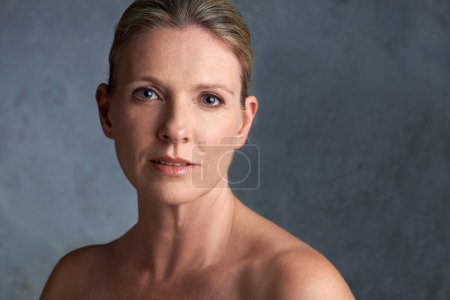 Photo for Mature woman, skincare model and portrait with natural beauty and cosmetic dermatology. Isolated, gray background and female person face with facial treatment and self care with anti aging cosmetics. - Royalty Free Image