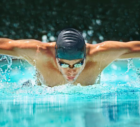 Photo for Water splash, sport and training with man in swimming pool for competition, workout and energy. Strong, fitness and cardio with male swimmer and practice for athlete, championship and race at gala. - Royalty Free Image