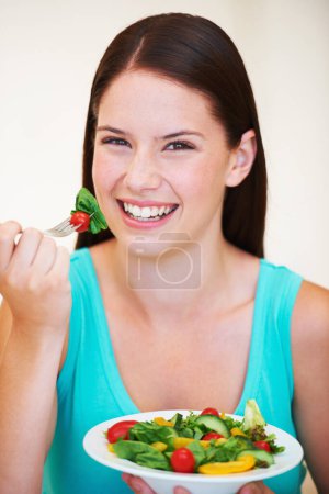 Photo for Salad, healthy food and portrait of a happy woman with vegetables, nutrition and health benefits. Face of a female person on a nutritionist diet and eating vegan for weight loss, wellness or detox. - Royalty Free Image
