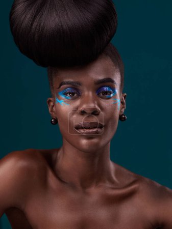 Photo for Portrait, hair care and makeup with a model black woman in studio on a blue background for fashion. Face, hairstyle and cosmetics with a beautiful young female person at a salon for beauty or styling. - Royalty Free Image