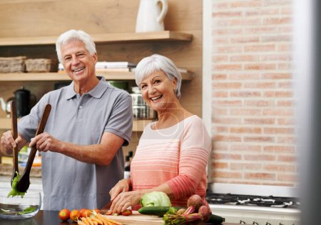 Photo for Cooking, help and portrait of old couple in kitchen for salad, love and nutrition. Happy, smile and retirement with senior man and woman cutting vegetables at home for food, dinner and recipe. - Royalty Free Image