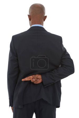Photo for Unethical business. An African-American businessman with his fingers crossed behind his back - Royalty Free Image